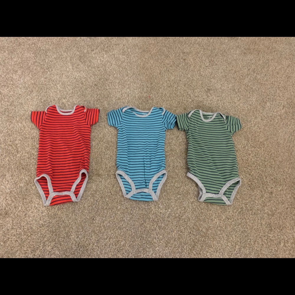Three Carter’s onesies.